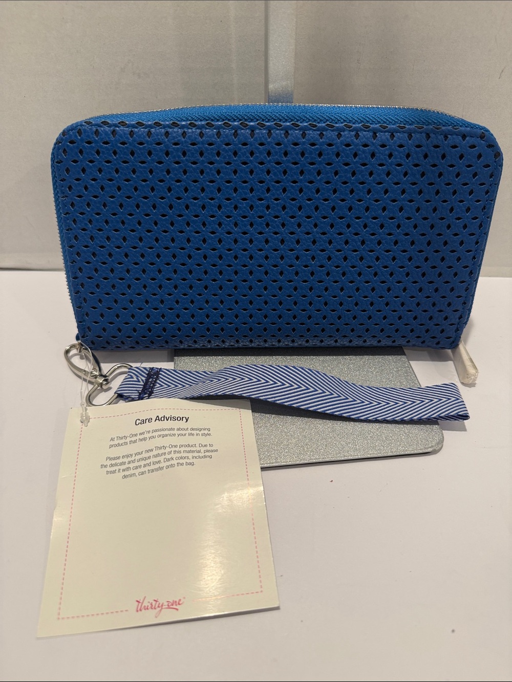 NWT thirty-one Perforated Royal Blue Wristlet with Striped blueStrap